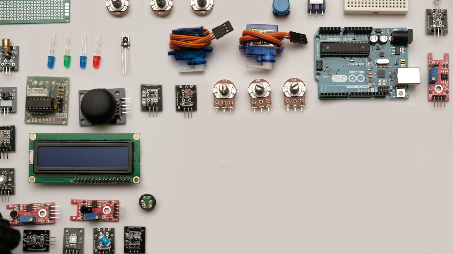 assorted-color capacitors on white surface